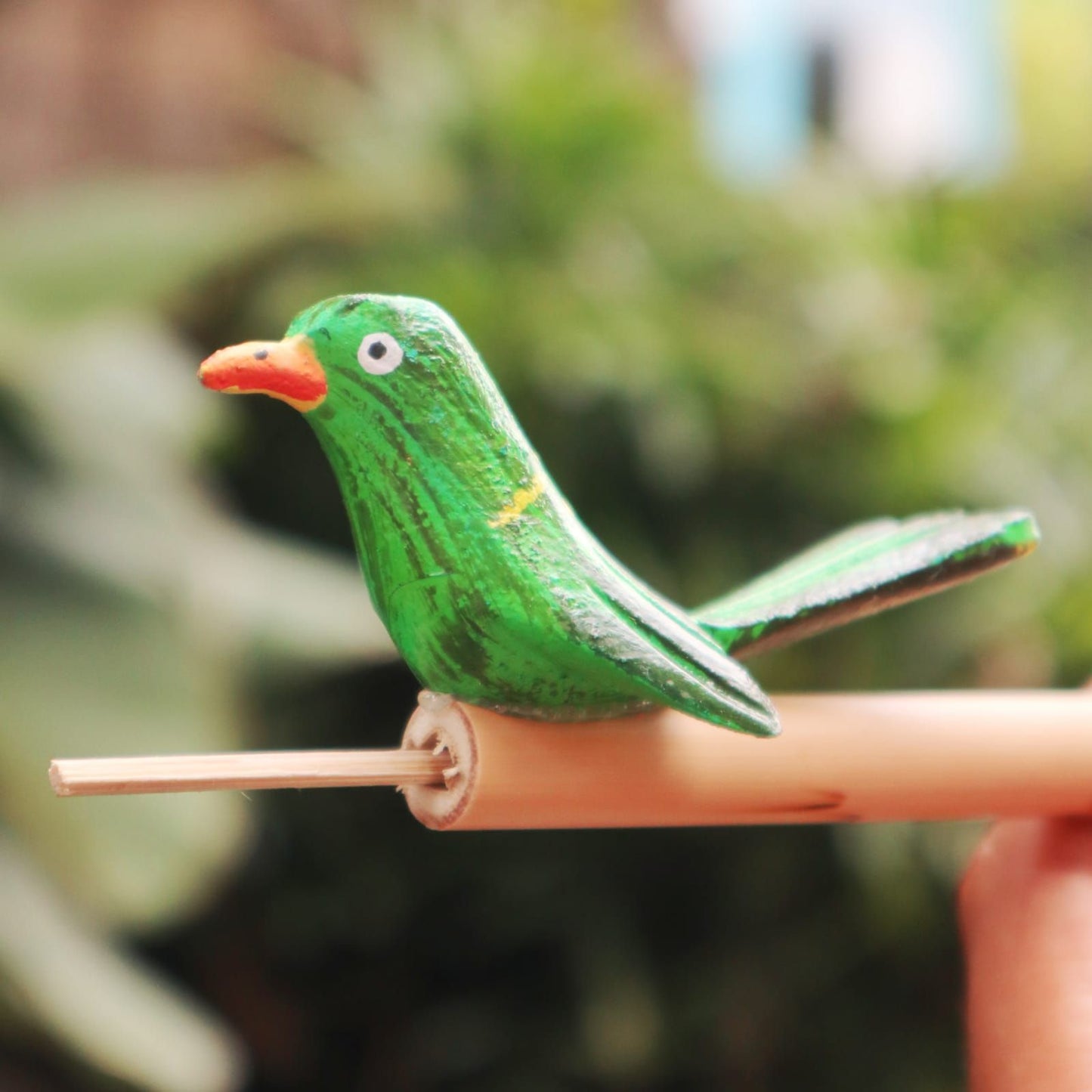 Small colourful bird-shaped whistle handcrafted with a vibrant finish, ideal for nature-inspired sound effects.