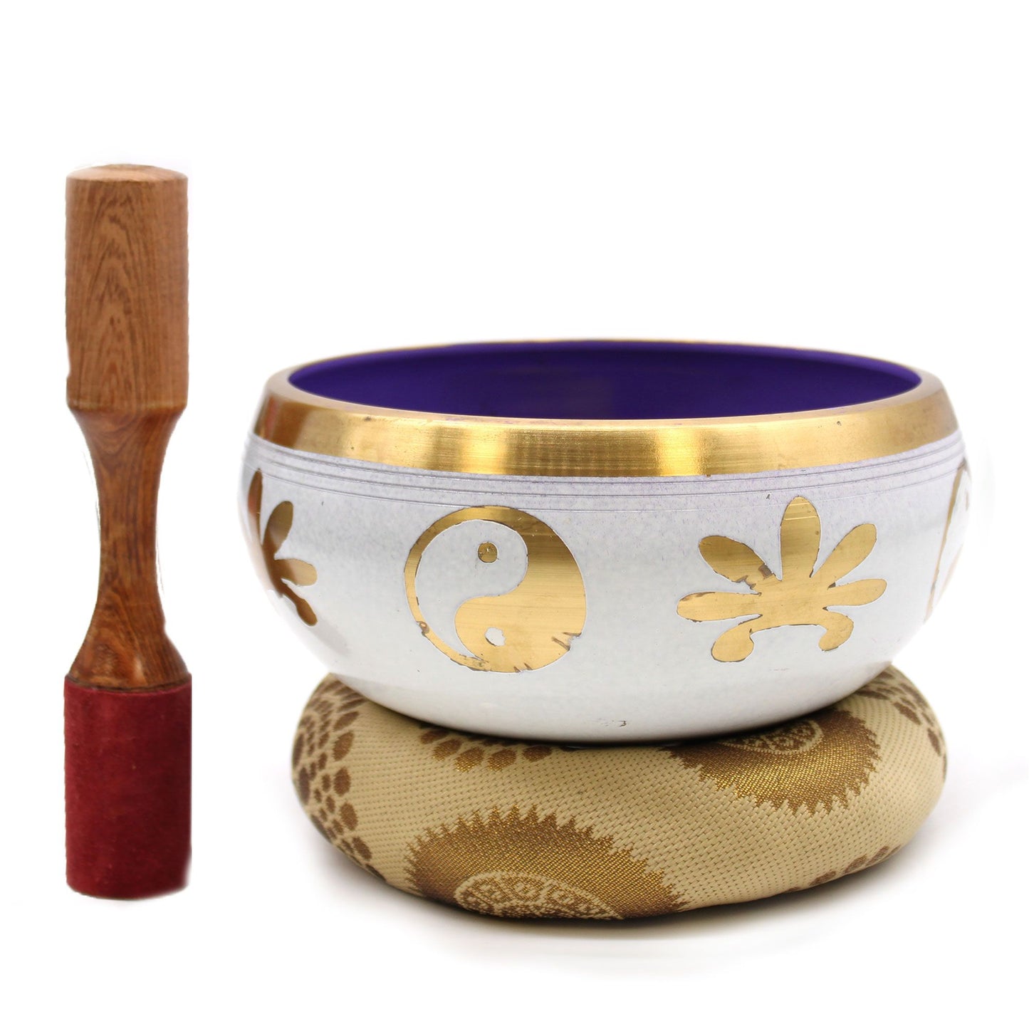 Large white and purple Tibetan singing bowl with a Yin Yang design, resting on a matching cushion with a wooden striker.
