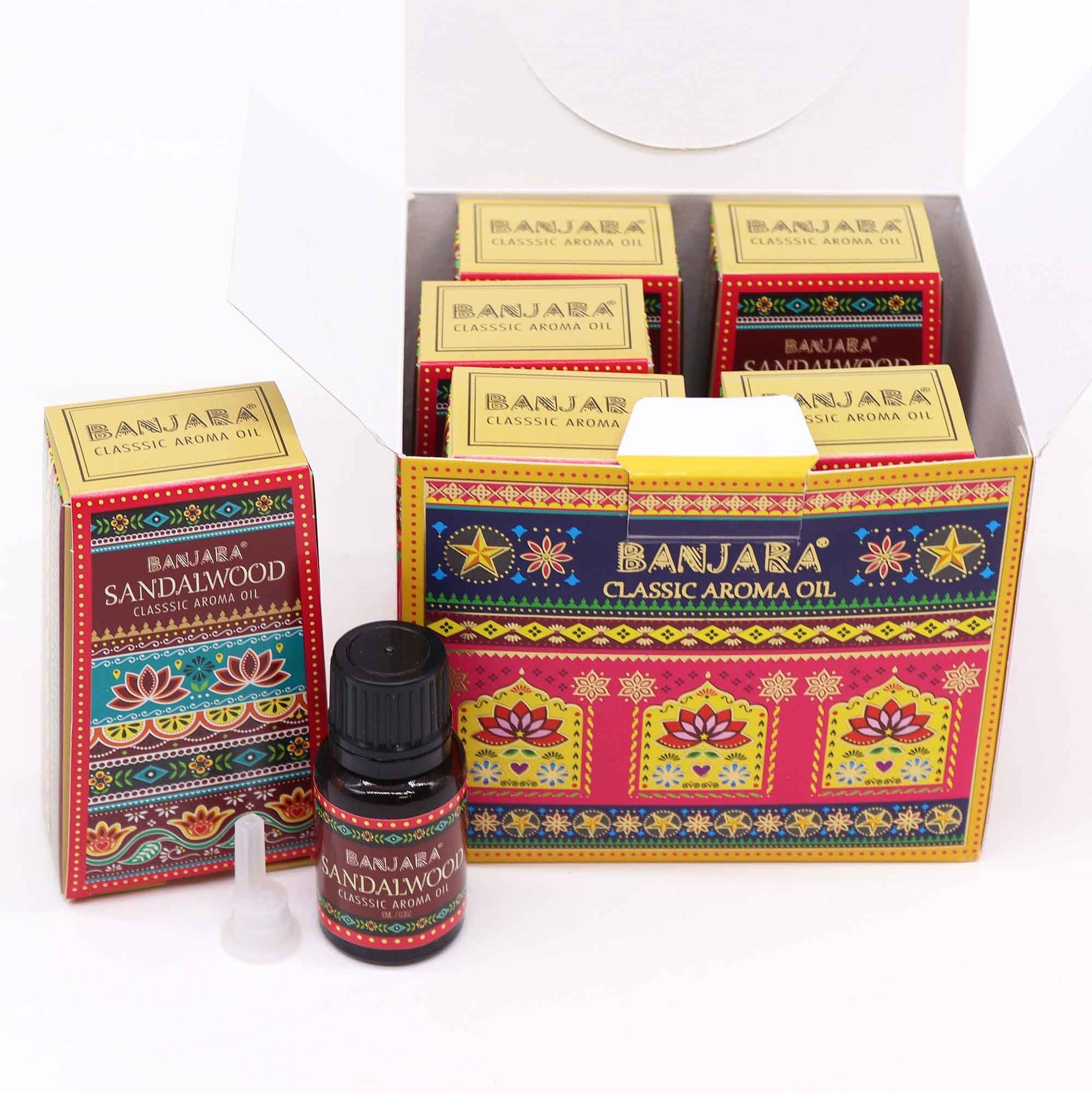 Small brown glass bottle of Sandalwood fragrance oil with a decorative label showing a wooden background.