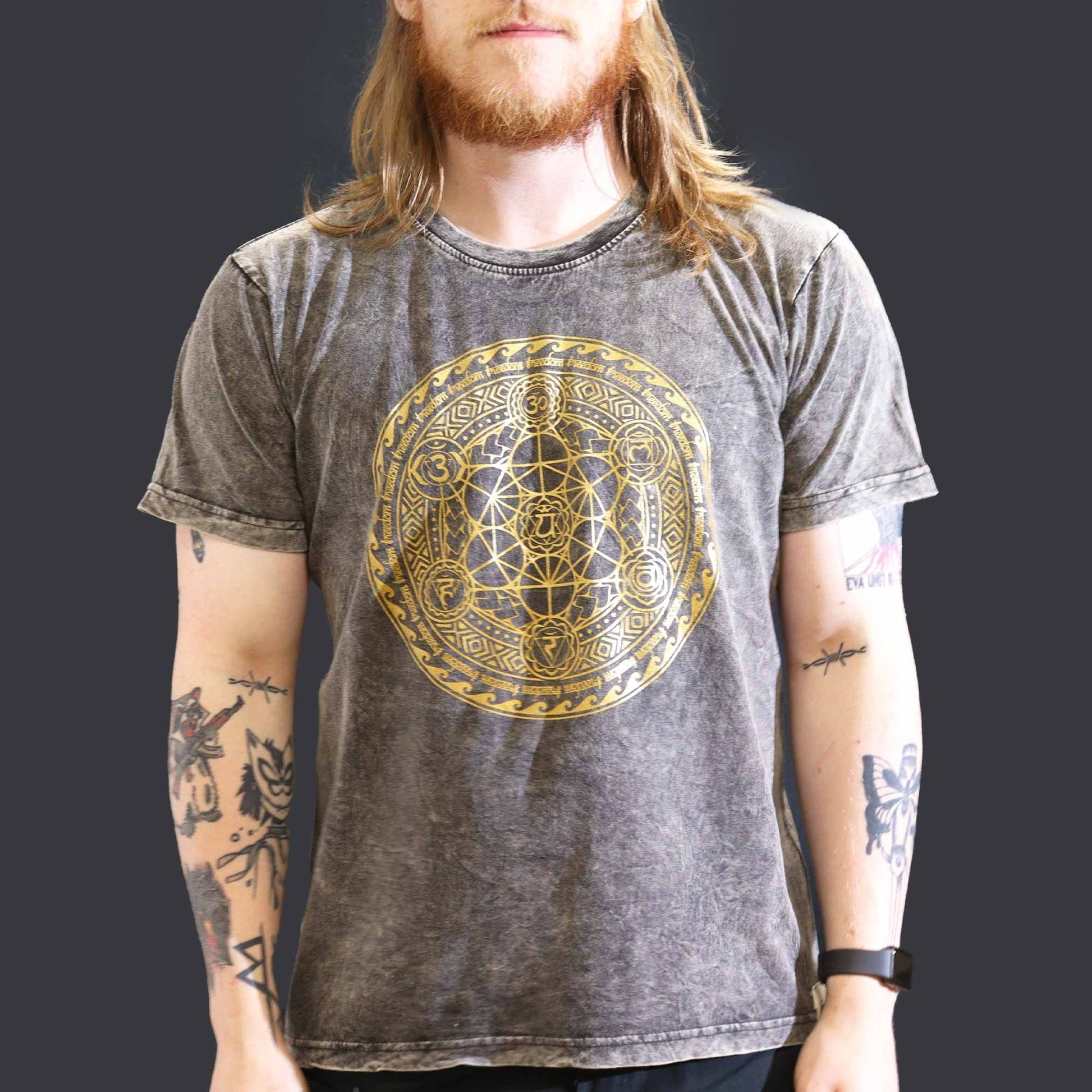 Large dark grey stonewashed t-shirt featuring a vertical alignment of colourful chakra symbols on the front.