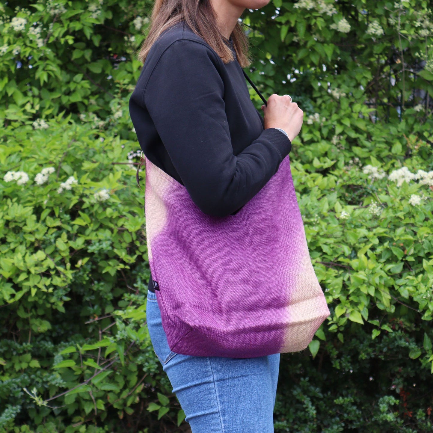 Vibrant antique fuchsia handcrafted shoulder tote bag made from a soft jute and cotton blend.