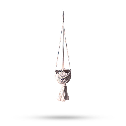 Hand-woven beige macrame plant hanger featuring intricate knots and a decorative fringe for indoor pots.