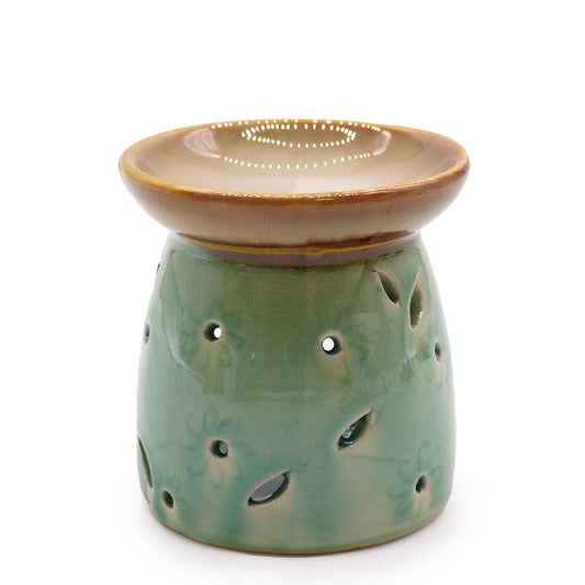 Elegant deep blue ceramic oil burner with a classic rounded design and a deep bowl for oils.
