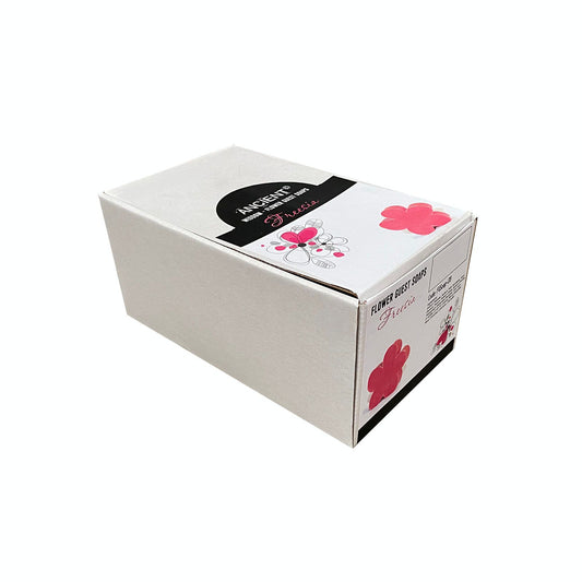 Delicate green flower-shaped guest soaps with a detailed petal design, perfect for bathroom decor.