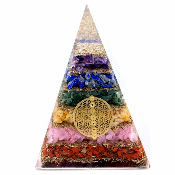 Large resin pyramid containing colourful chakra stones and a gold-tone Flower of Life symbol at the centre.