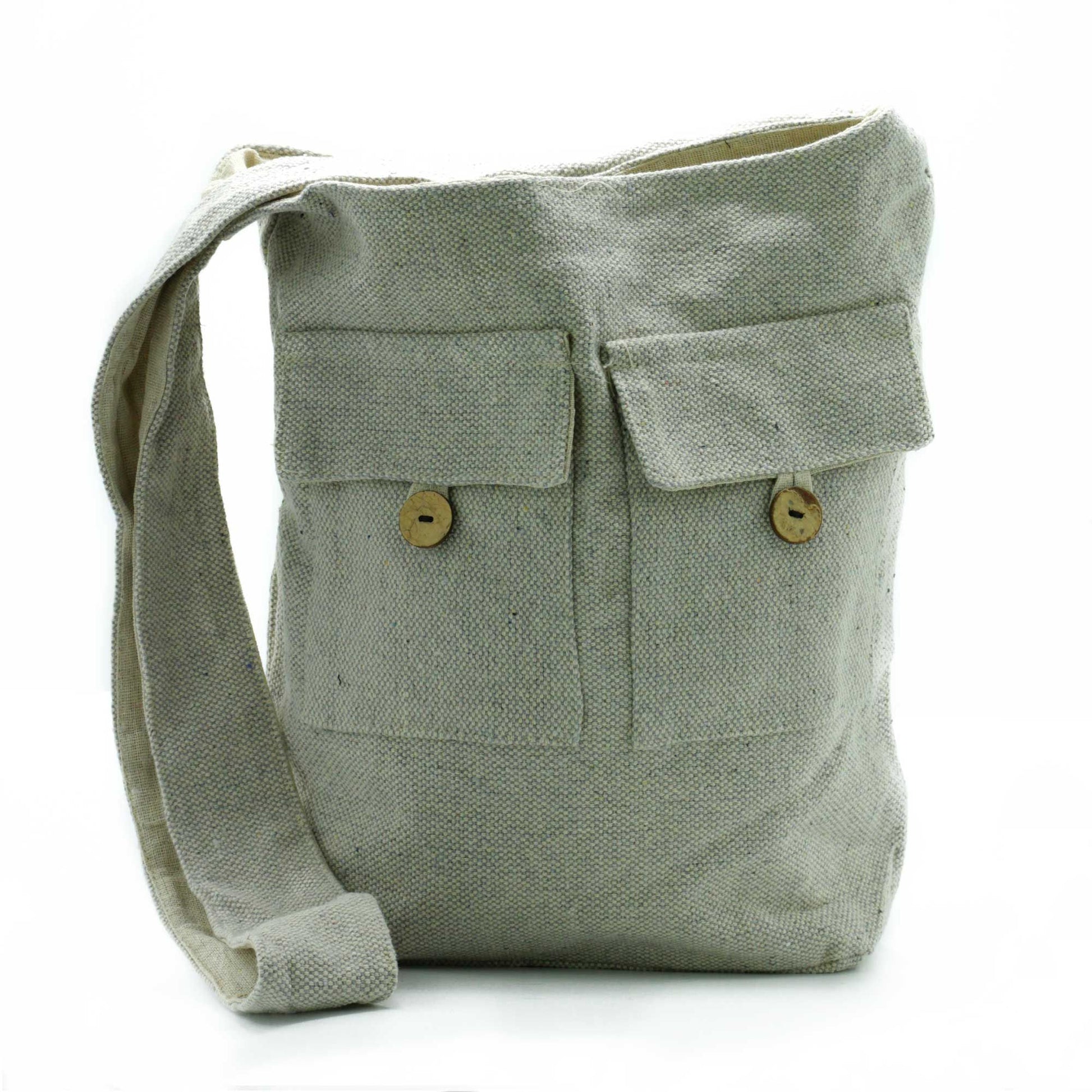 Large minimalist stone-coloured cotton canvas tote bag featuring two front pockets and sturdy shoulder straps.