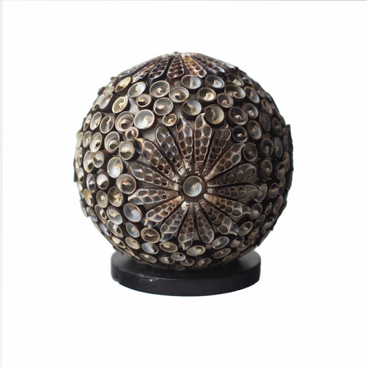 Handcrafted globe-shaped lamp made from real seashells in a decorative chocolate brown twist pattern.