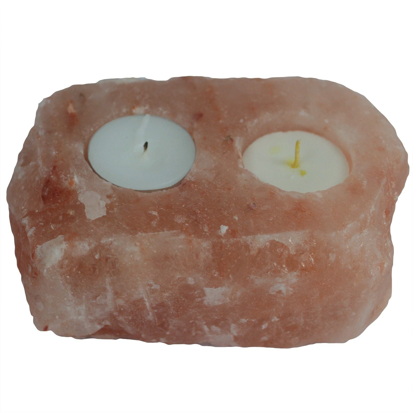 Handcrafted pink Himalayan salt candle holder with two holes for tea lights, showing natural crystalline texture.