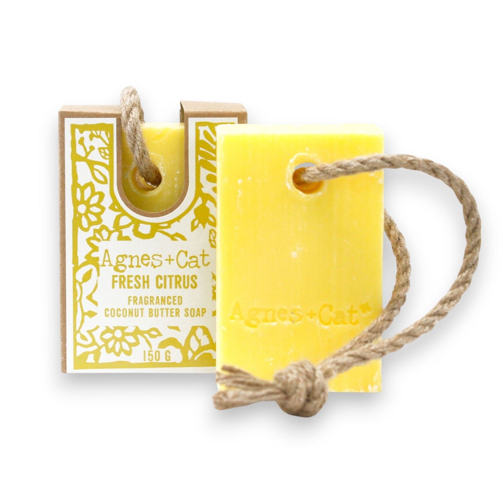 Zesty yellow soap on a natural rope hanging in a bright bathroom setting.