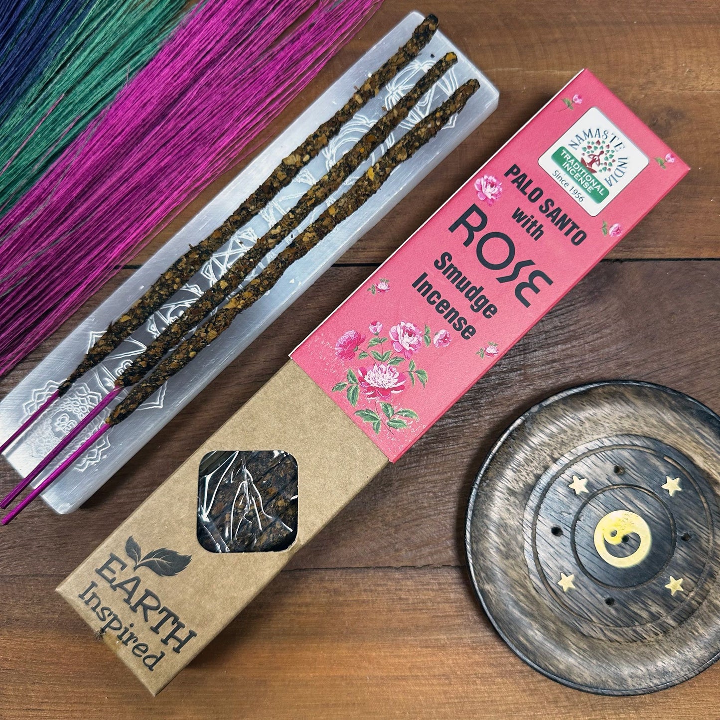 Handcrafted rose smudge incense sticks made with natural herbs and essential oils for spiritual cleansing.