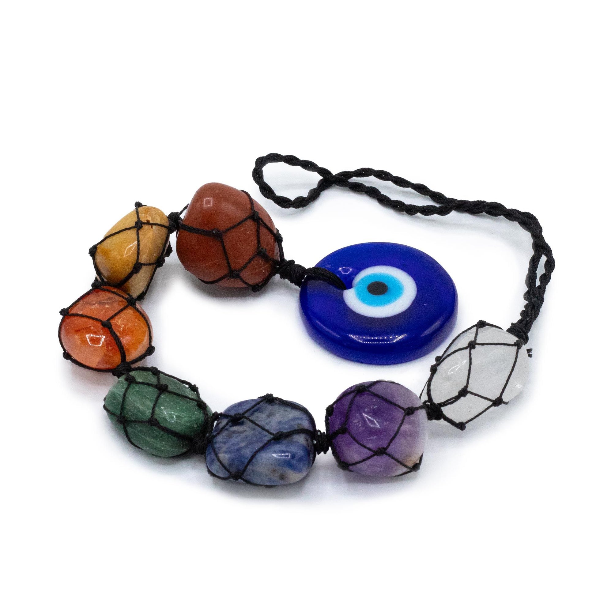 A hanging spiritual ornament featuring seven colourful chakra gemstones and a blue glass evil eye charm.