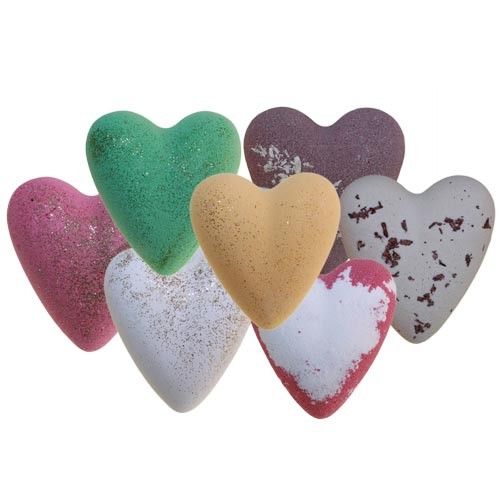 A colourful assortment of heart-shaped bath bombs with a fizzy, textured surface for a relaxing aromatherapy bath.
