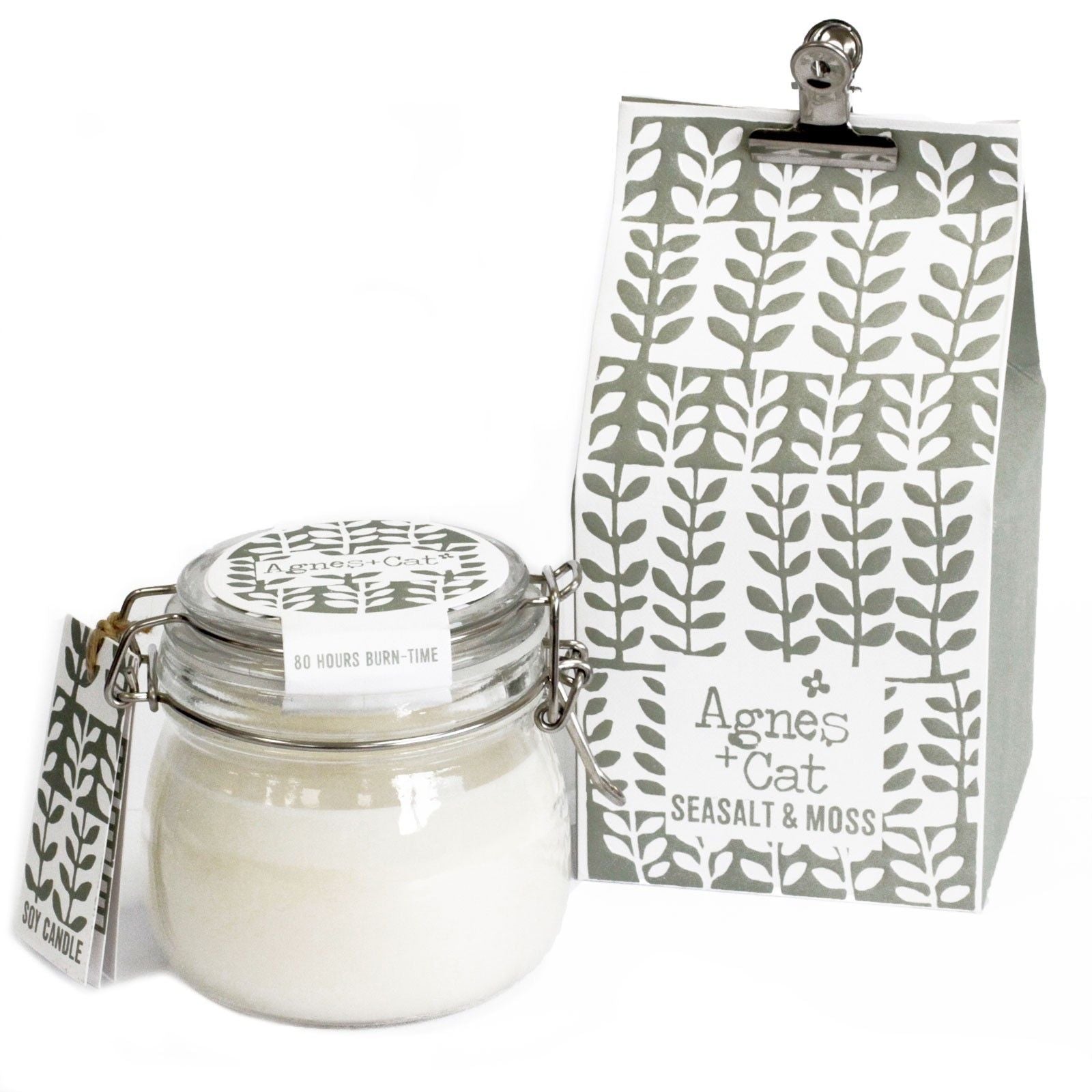 Large glass kilner jar candle filled with white soy wax and a single wick in a rustic style.
