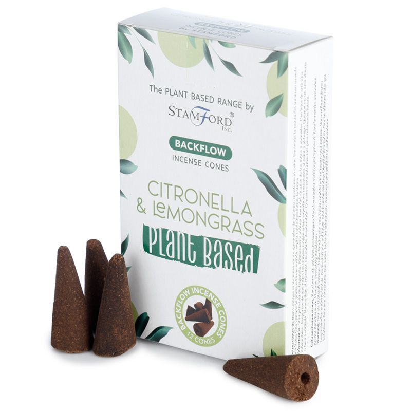 Yellow plant-based backflow incense cones scented with citronella and lemongrass on a neutral background.