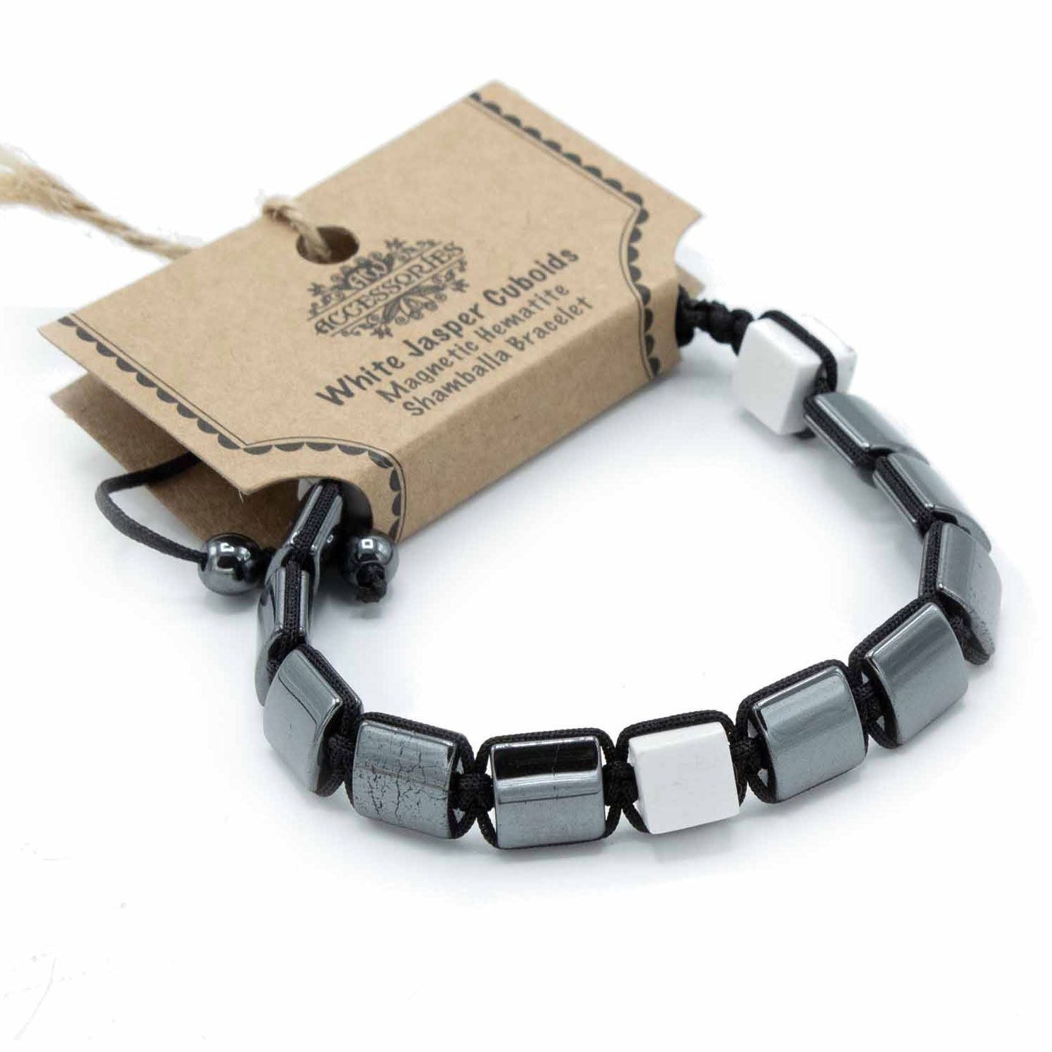 Magnetic hematite shamballa bracelet featuring sleek black beads and white jasper cuboid stones.