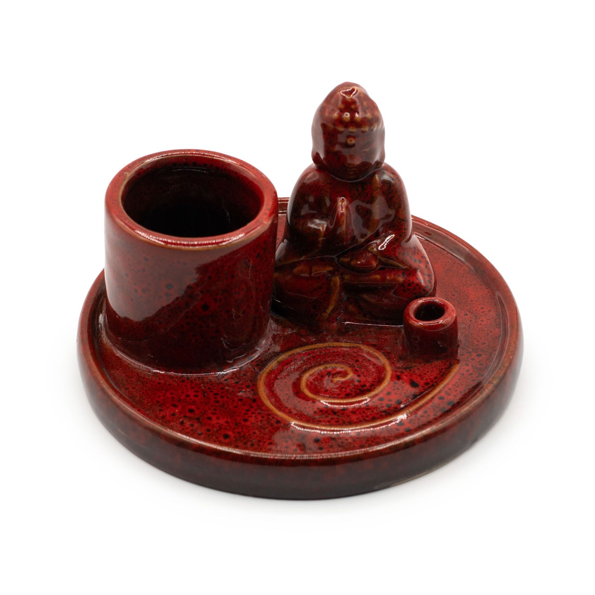 Circular soft red ceramic incense plate featuring a small seated Buddha figure in the centre.