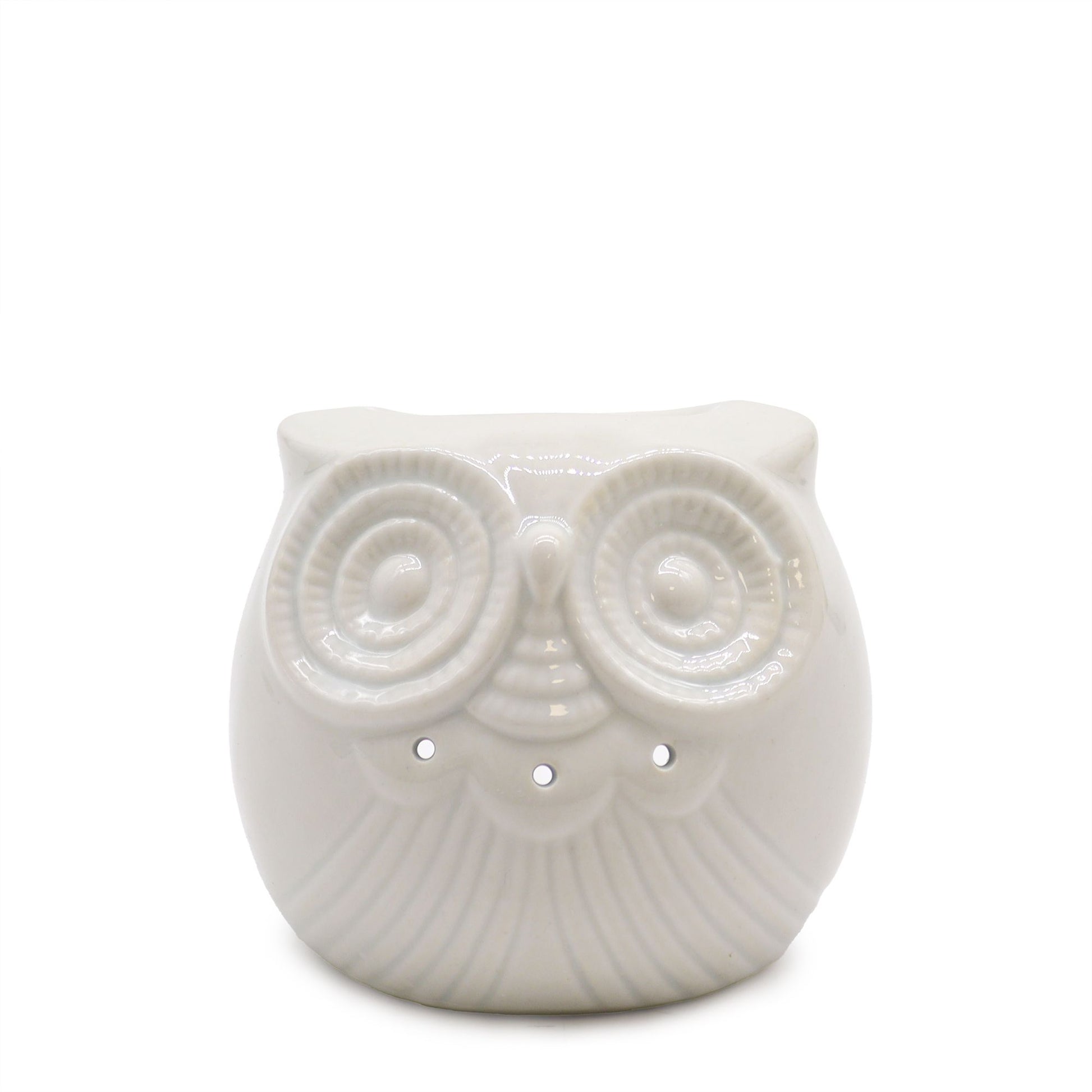 Small white ceramic oil burner with a decorative owl cutout design on a clean background.