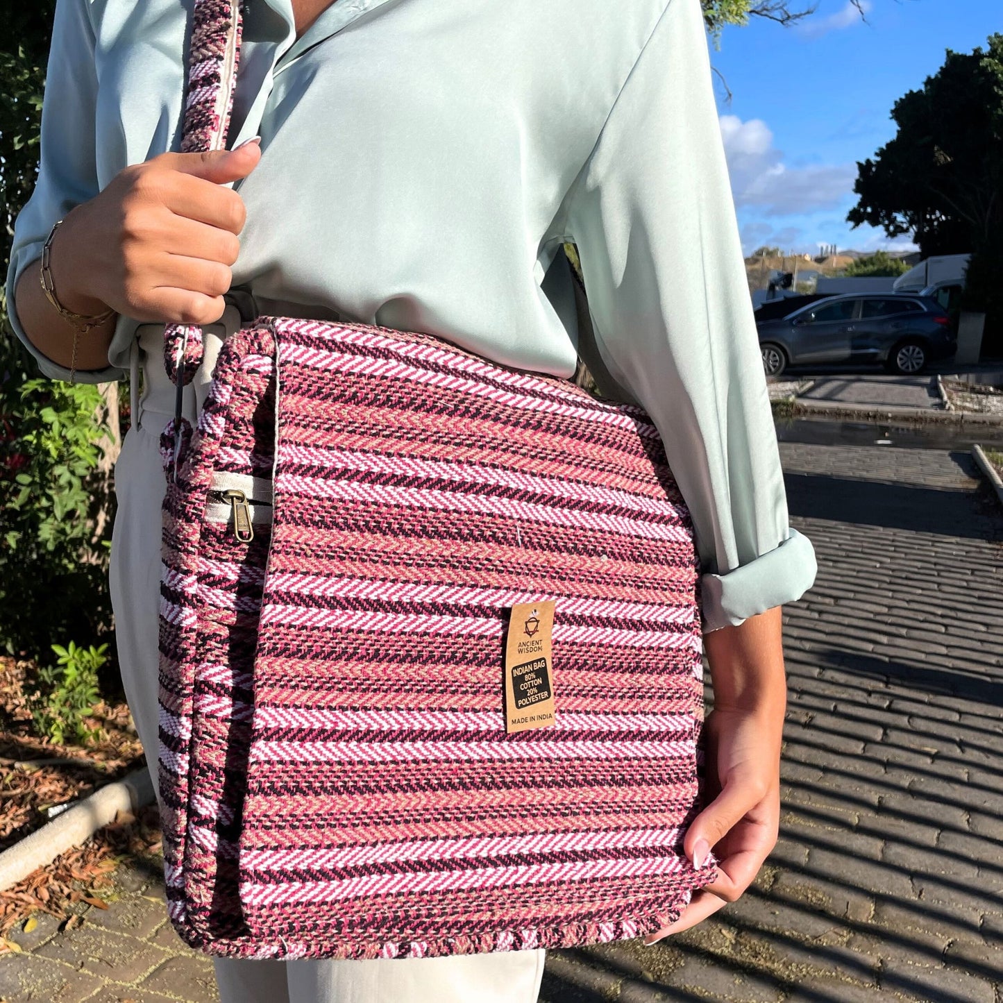Soft pink padded laptop bag with a clean, minimalist design and secure zip closure.