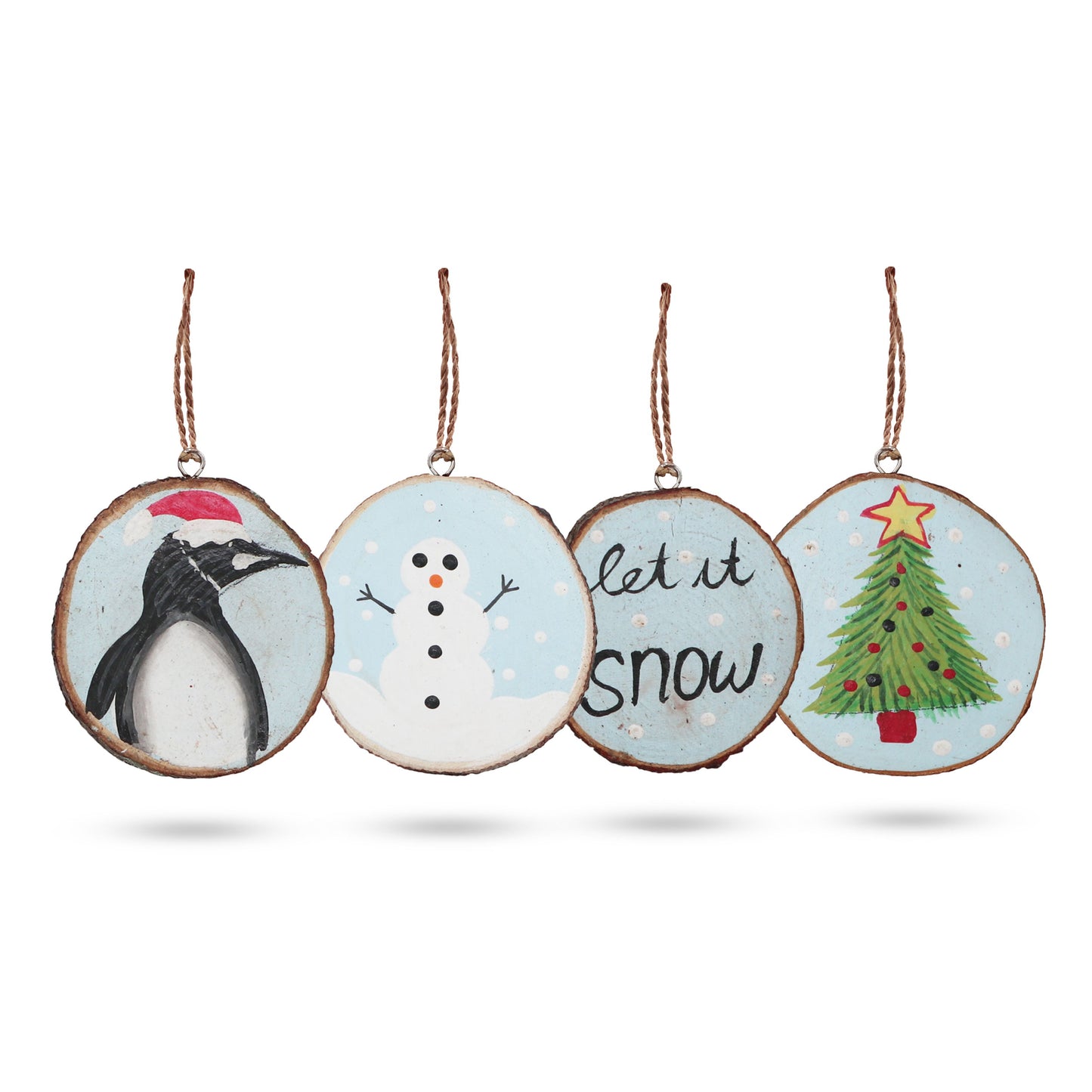 Set of four rustic hand-painted wooden log slices featuring festive Let it Snow winter designs for Christmas decorating.