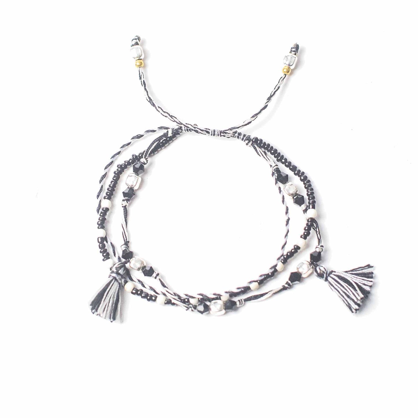 Handcrafted black string bracelet featuring small silver beads and a minimalist adjustable design.