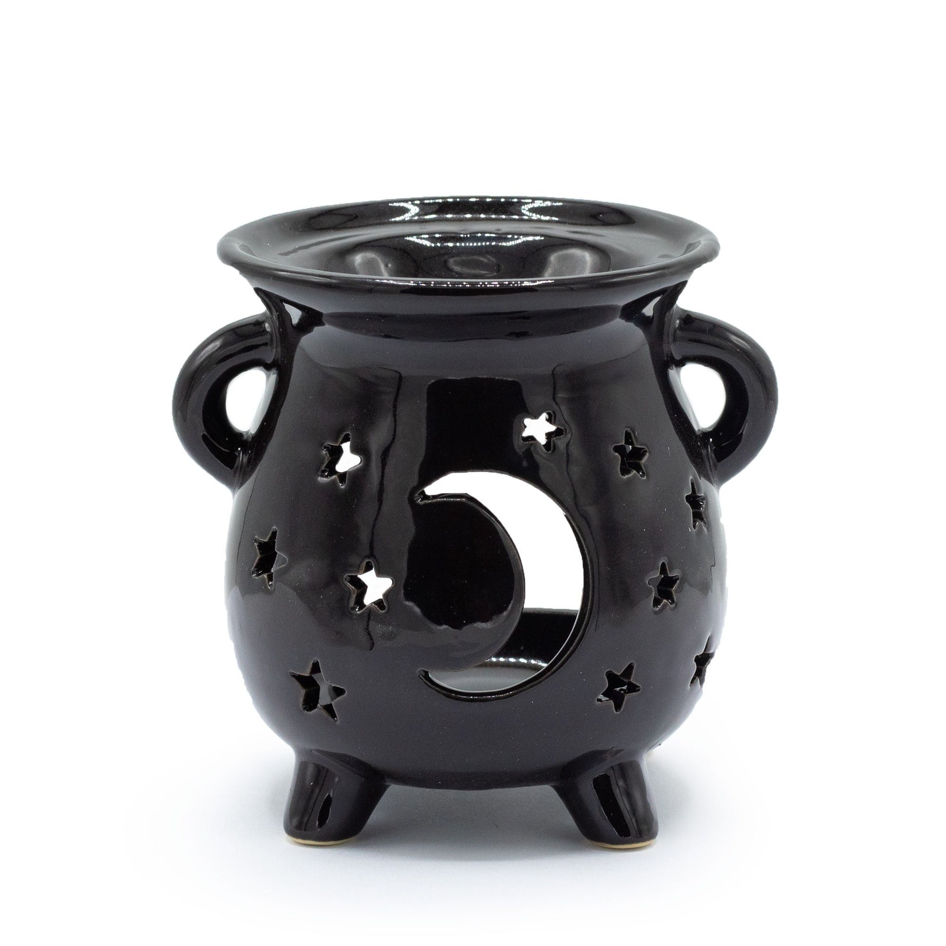 Black ceramic cauldron-shaped oil burner with carved moon and star patterns and a sturdy three-legged base.