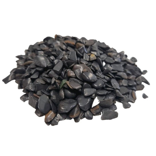 Large bag of small polished black tourmaline gemstone chips with a natural dark lustre.