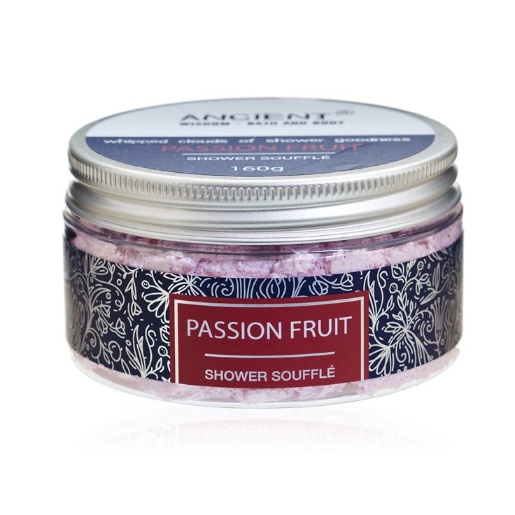 Creamy and fluffy passion fruit scented shower soufflé foam in a clear jar.