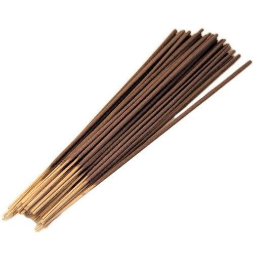 Large bundle of traditional sandalwood incense sticks showing textured brown aromatic coating and wooden cores.