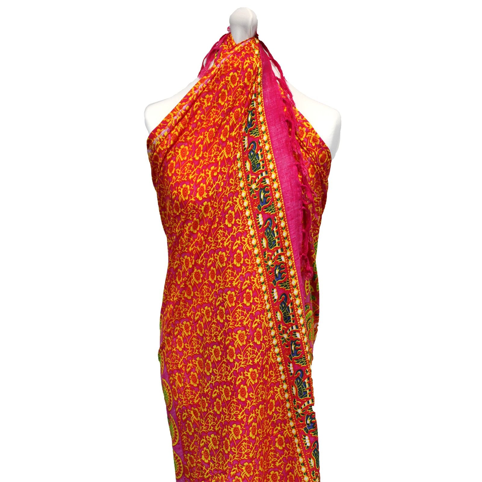 Vibrant ruby and lime green mandala patterned sarong draped elegantly as a beach wrap.