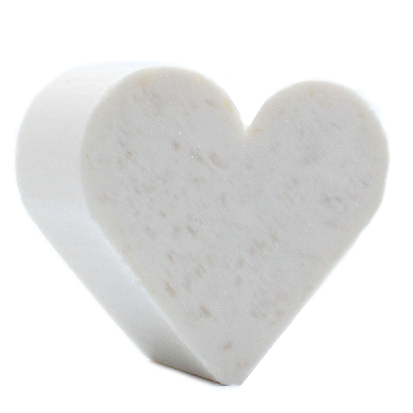 Small white heart-shaped soaps with a smooth texture, perfect for a guest bathroom display.