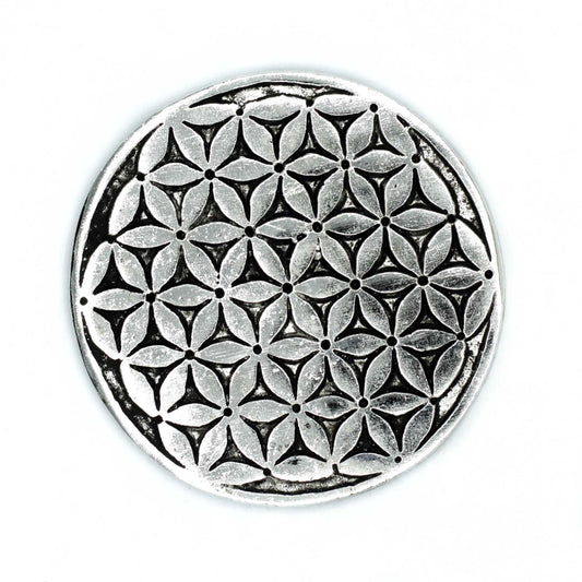 Round polished aluminium incense holder featuring an etched Flower of Life geometric pattern.