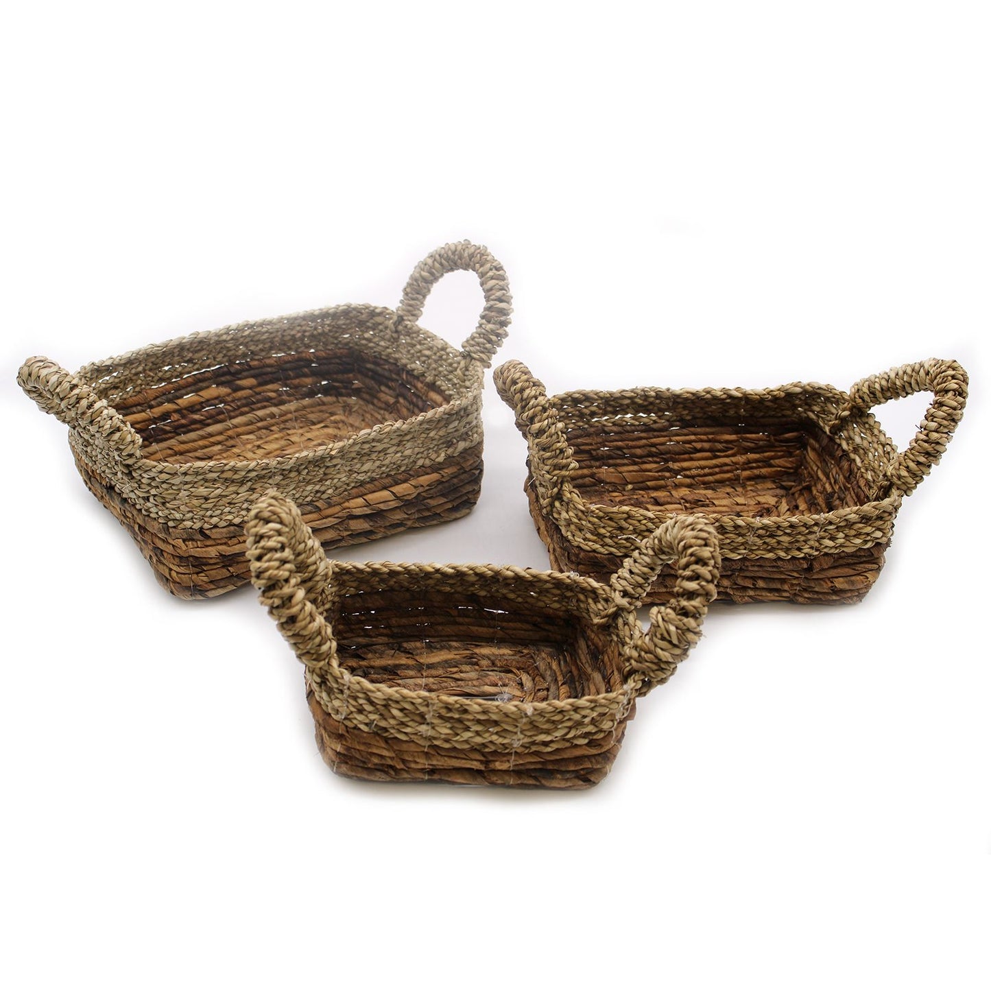 Set of three nesting square baskets handcrafted from natural woven banana leaf and seagrass with a rustic textured finish.