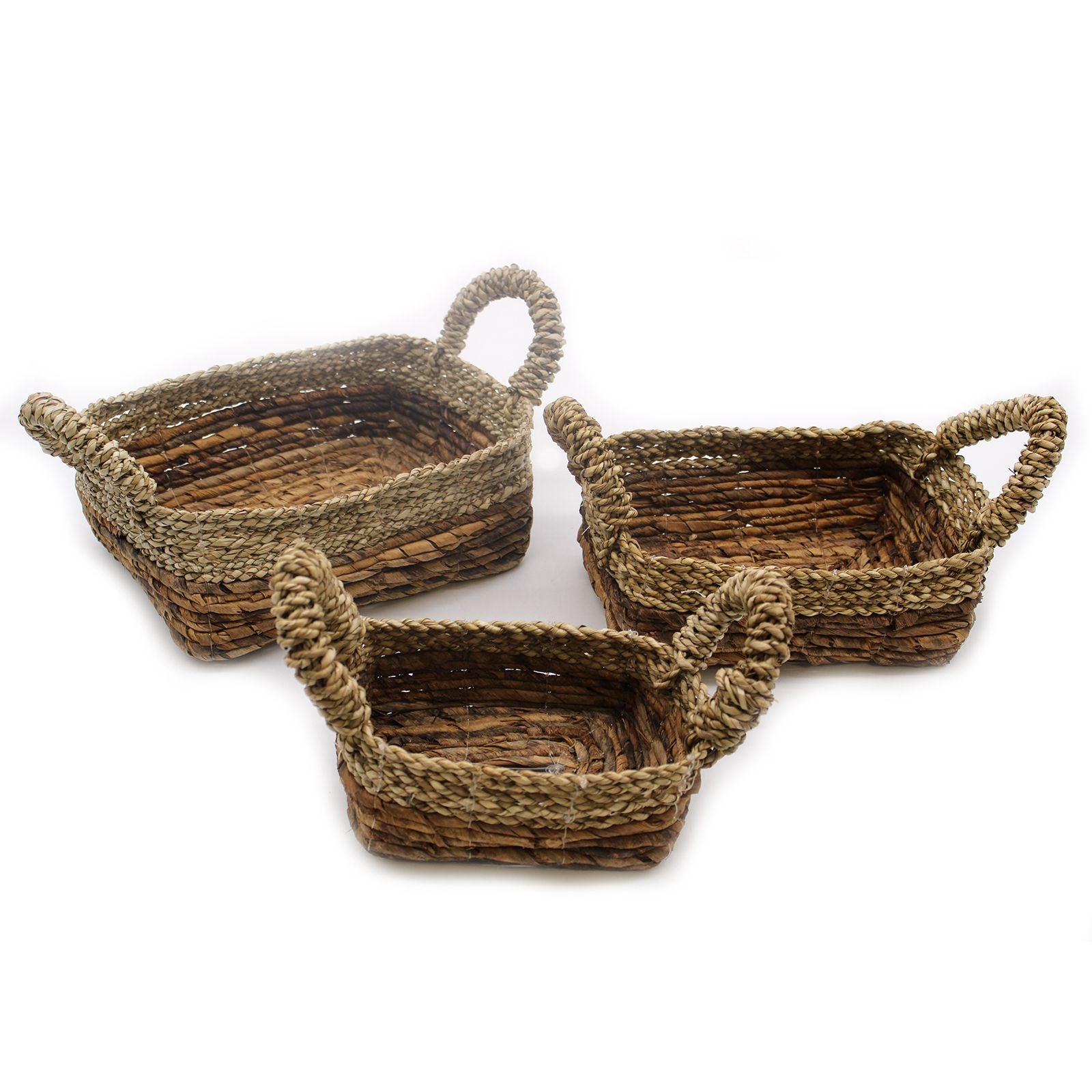 Set of three nesting square baskets handcrafted from natural woven banana leaf and seagrass with a rustic textured finish.
