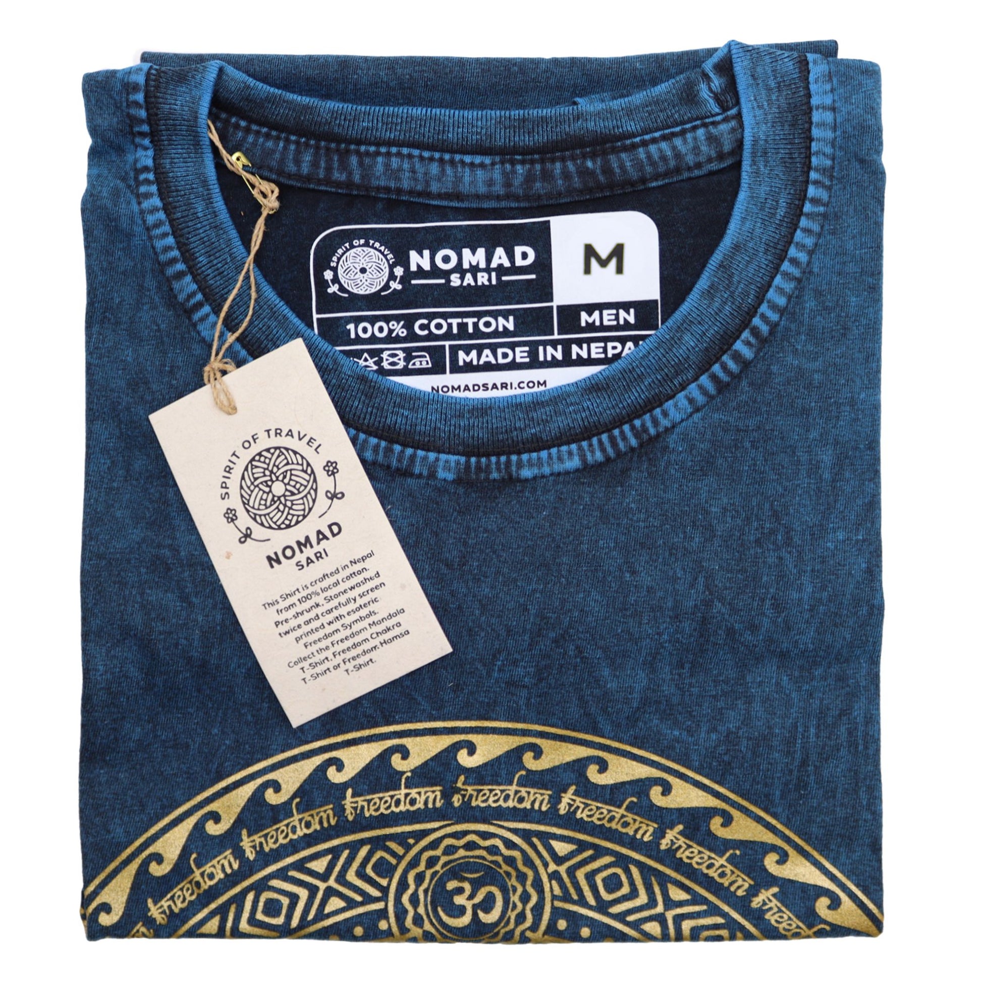 Close-up of a blue stone washed cotton t-shirt featuring a vertical seven chakra symbol design.