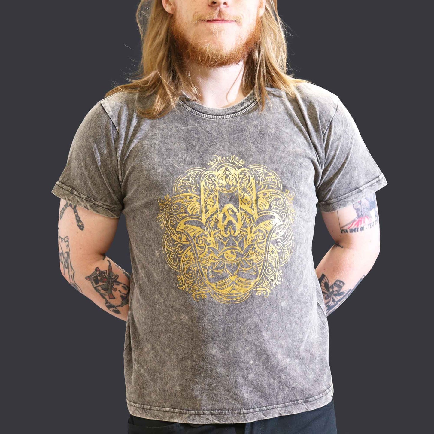 Large dark grey stone washed t-shirt featuring a central Hamsa hand symbol in a bohemian nomad style.