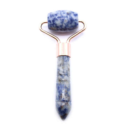 Small blue sodalite gemstone face roller with a silver-toned metal frame on a white background.