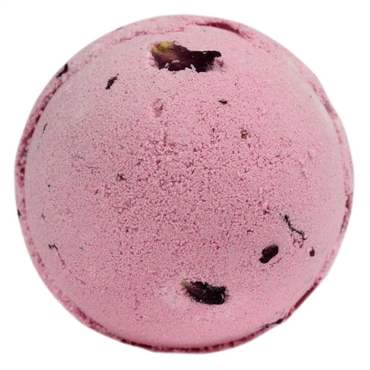 Large pink spherical bath bomb topped with delicate dried red rose petals on a white background.