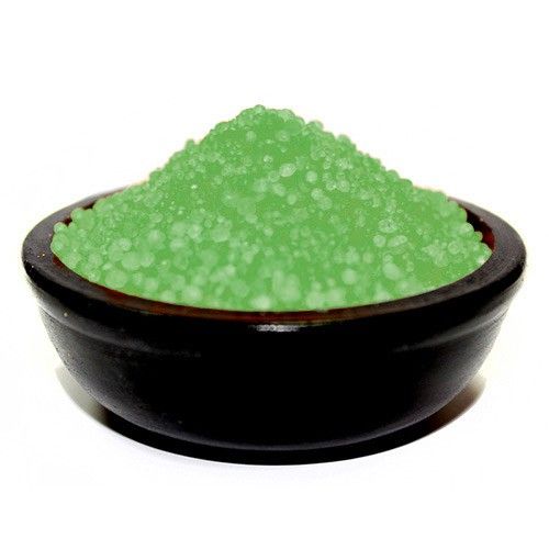 Close-up of festive red and green scented simmering granules used for home fragrance in an oil burner.
