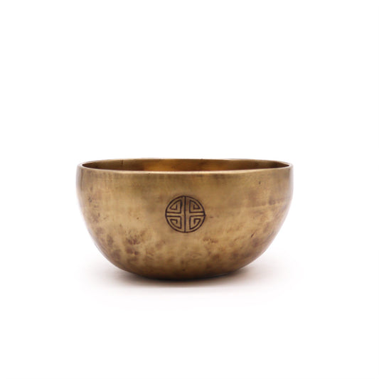 Handcrafted bronze-coloured Nepalese moon singing bowl with a smooth matte finish and traditional hammered texture.