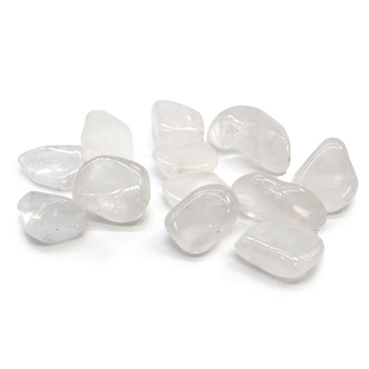 Highly polished clear and white Ice Quartz tumbled stones showing natural crystalline structures and smooth surfaces.