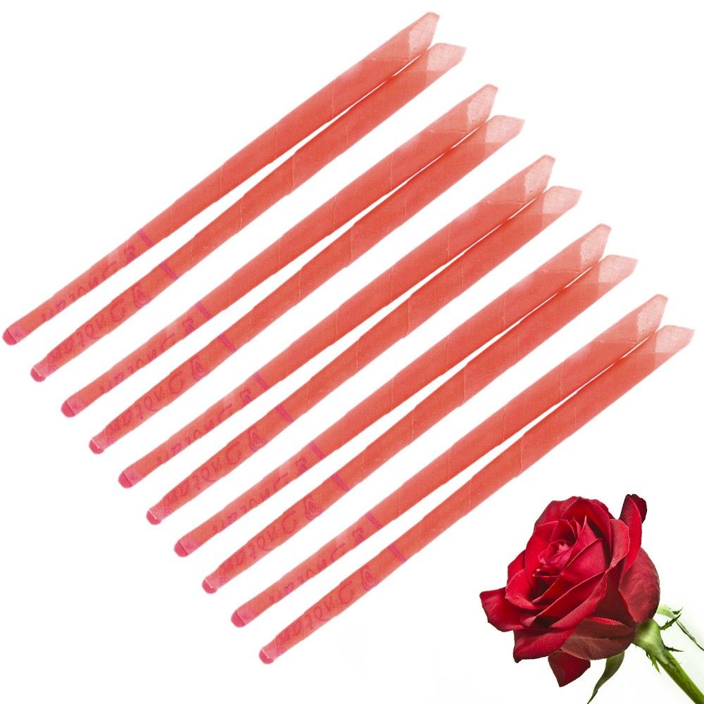 Two long, tapered pink ear candles with a textured surface, designed for holistic ear candling treatments.