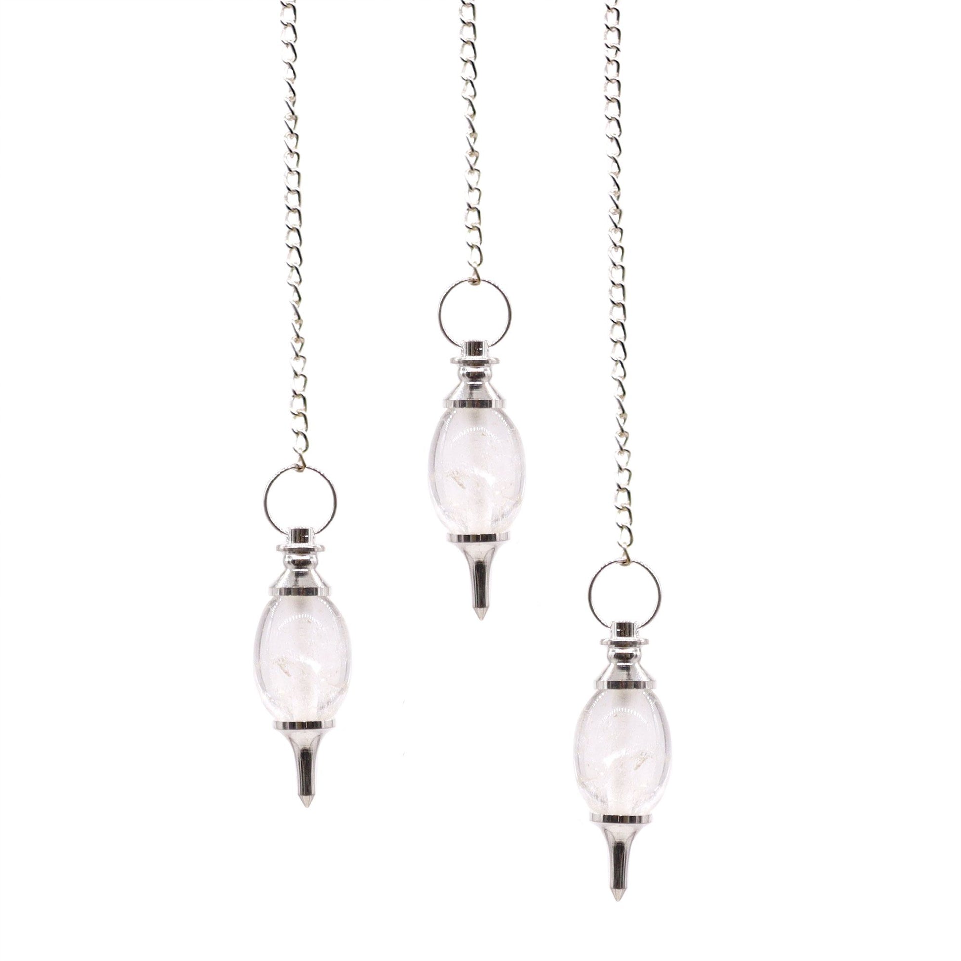 Clear rock quartz gemstone pendulum carved into a traditional lingam shape with a silver-toned metal chain.