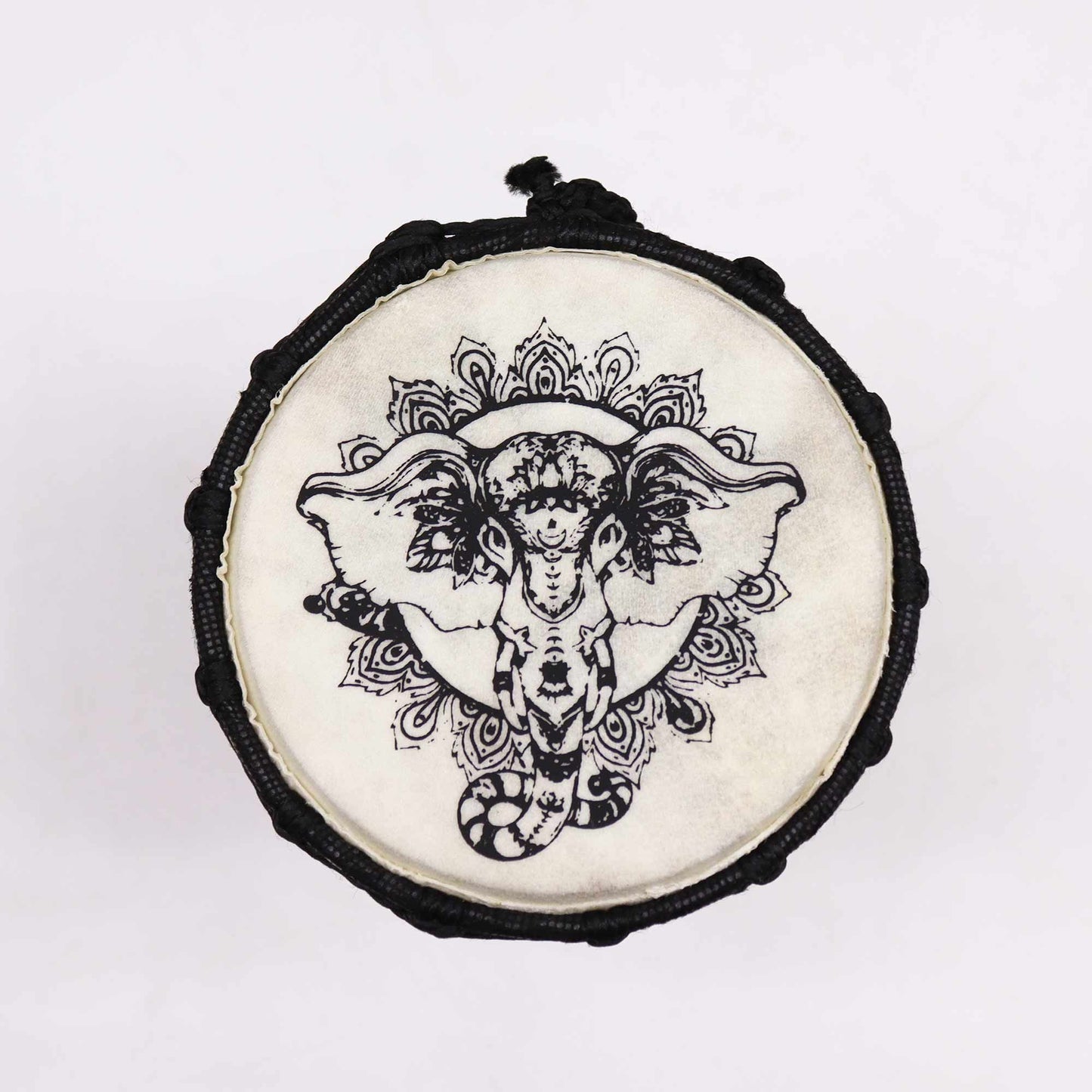 Handcrafted 20cm djembe drum with a wide top and a detailed elephant design on the natural skin head.