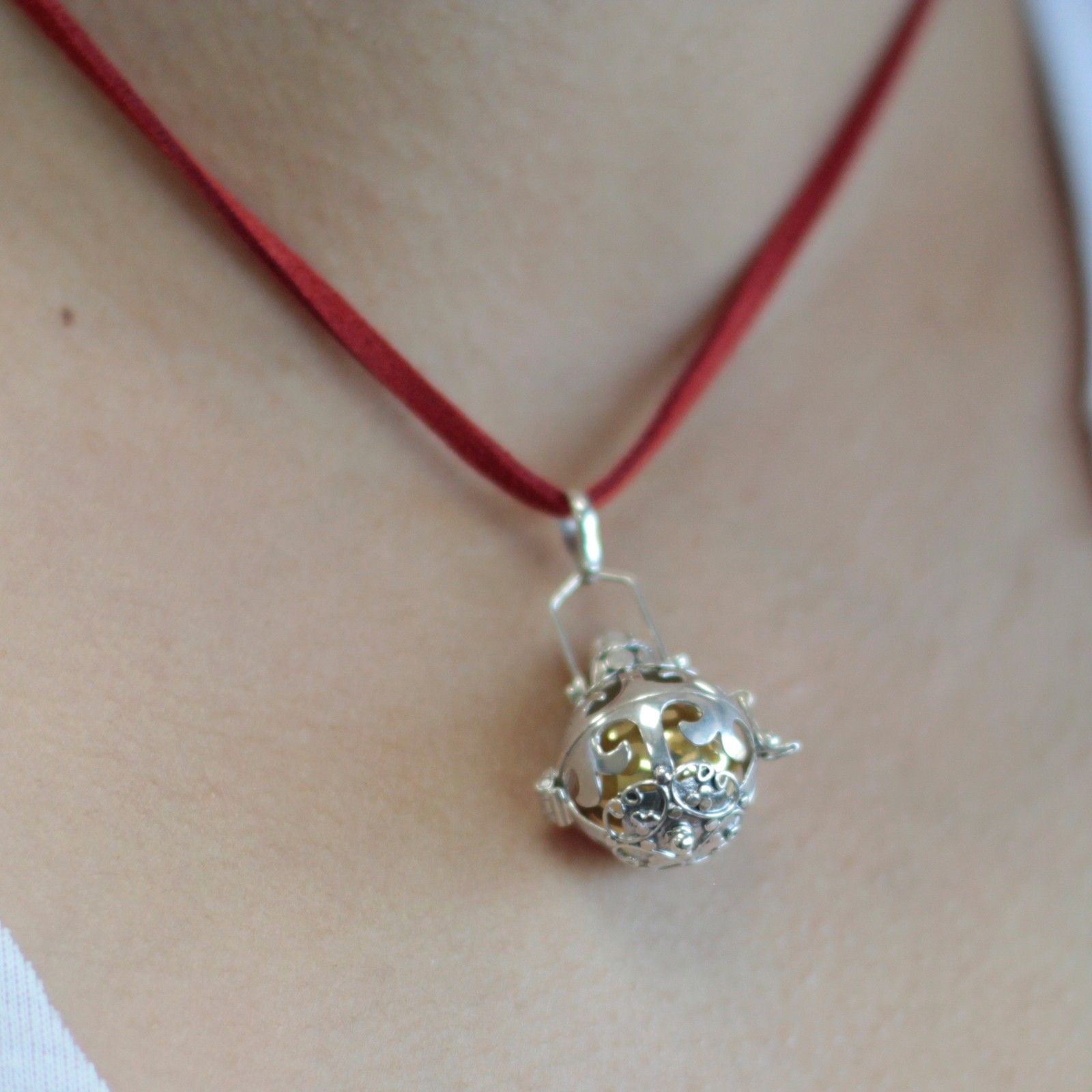 Intricately designed 925 sterling silver angel bell pendant with a polished finish and small ornate bale.