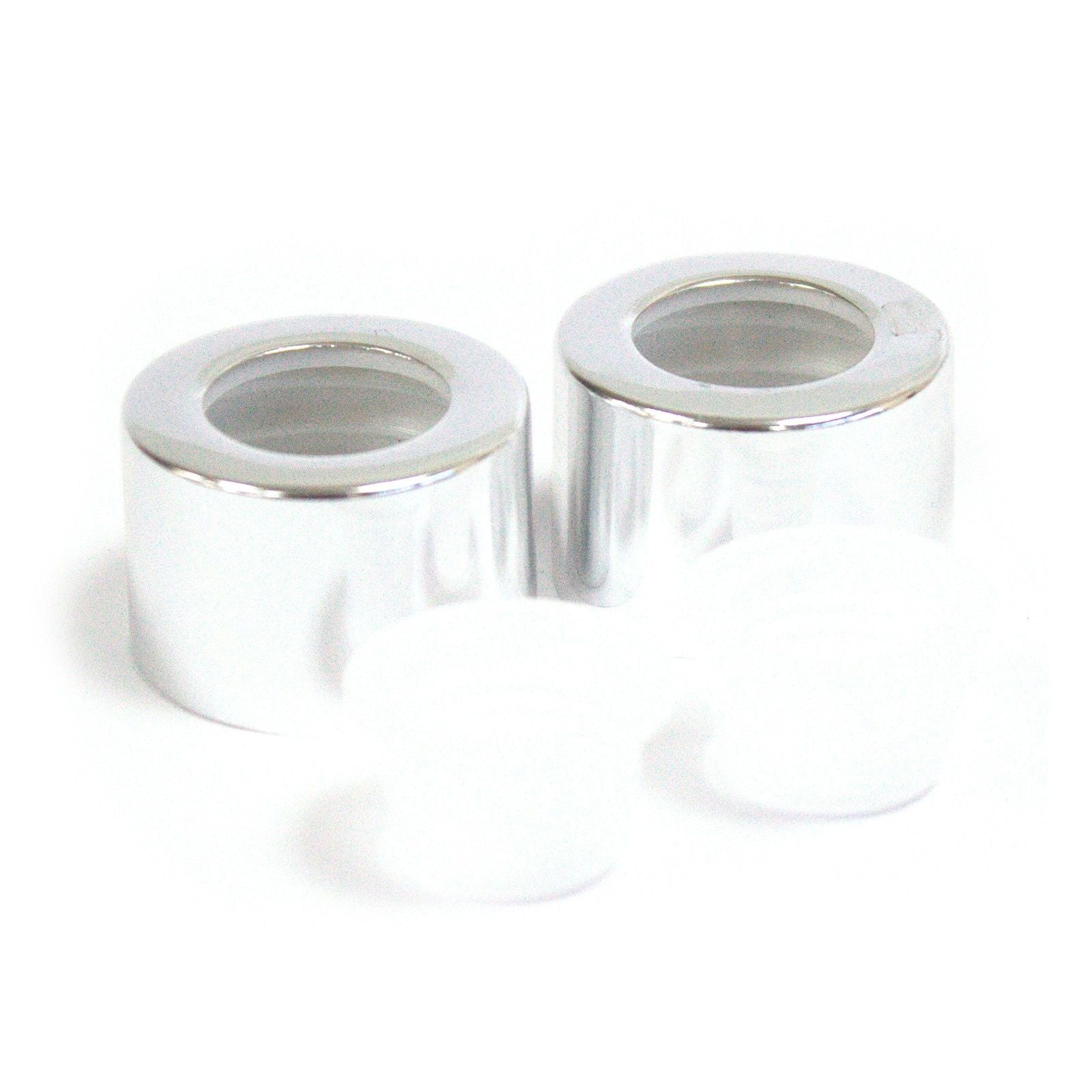 Sleek silver circular reed diffuser bottle cap with a matching travel plug and cork seal.