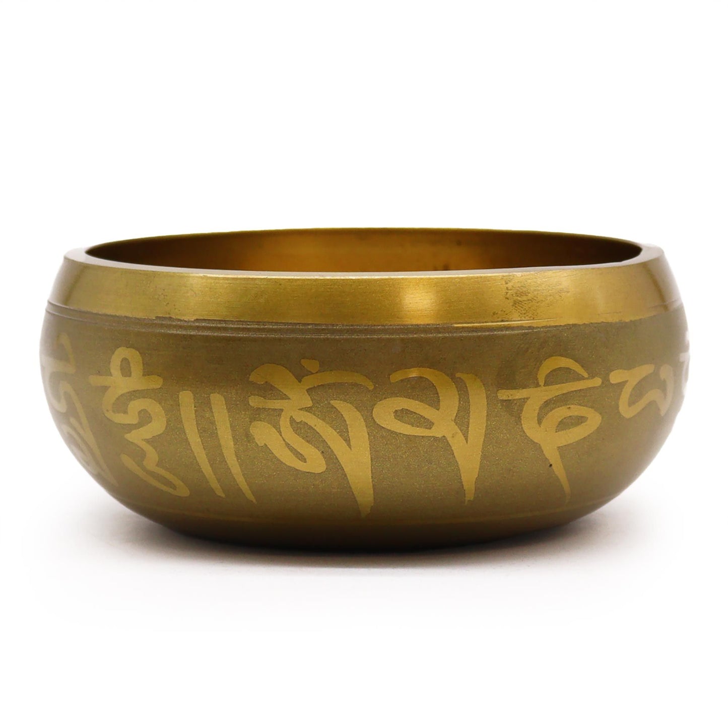 Large ornate brass singing bowl featuring an engraved image of Lord Ganesh with a wooden striker on a neutral background.