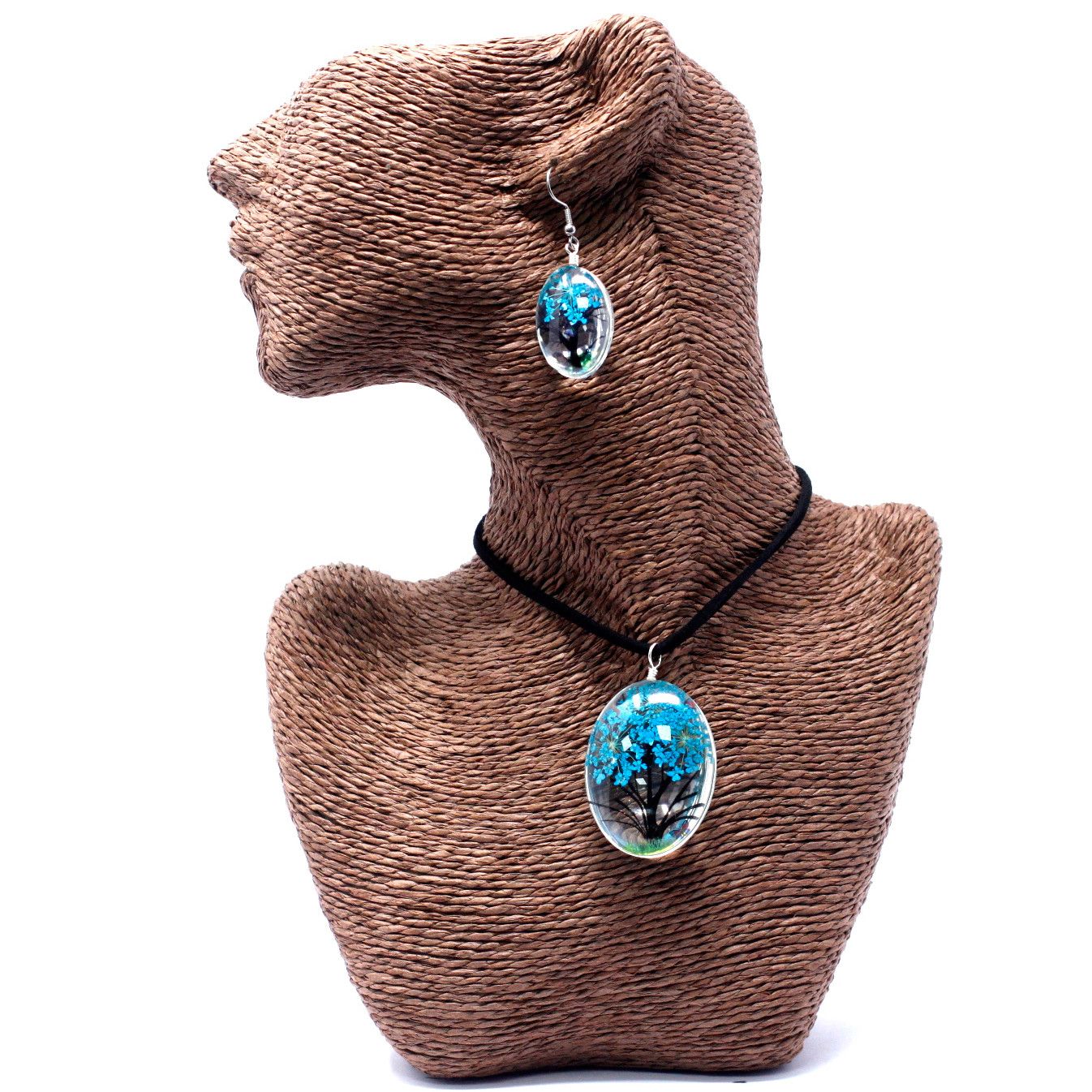 Teal tree of life necklace and earring set featuring real dried flowers preserved in glass pendants.