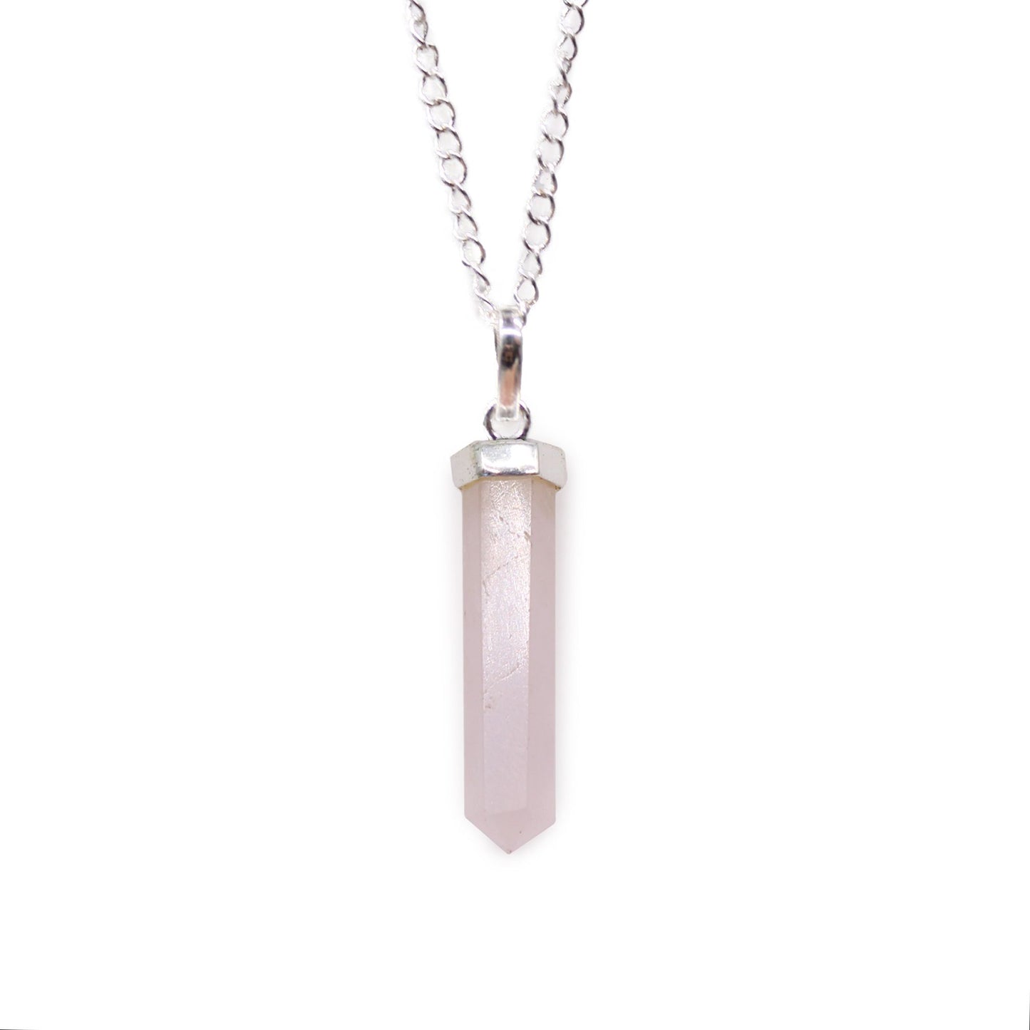 Rose Quartz gemstone pendant shaped into a polished hexagonal point with a silver-toned metal bale.
