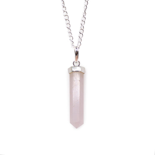 Rose Quartz gemstone pendant shaped into a polished hexagonal point with a silver-toned metal bale.