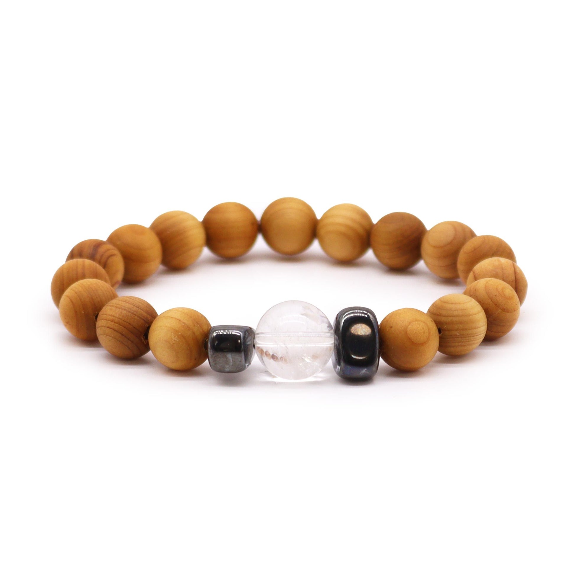 Handcrafted cedarwood bangle featuring a clear quartz gemstone and crown chakra symbol.